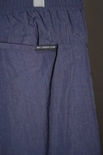 Load image into Gallery viewer, ANTi COUNTRY CLUB TOKYO 2026 SS - WHITE PIPING WARM-UP PANTS（NAVY) -
